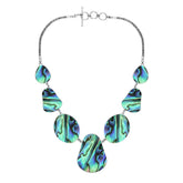 Women’s sterling silver necklace with teardrop abalone shell pieces and Bali-inspired accents.